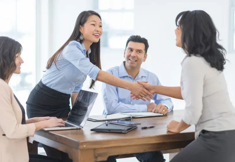 Business handshake representing a successful branding client partnership