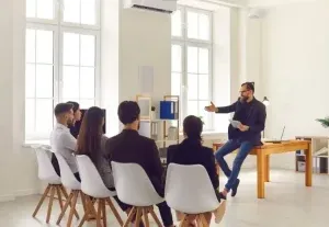 Presenter discussing local SEO strategy with a team in an office setting