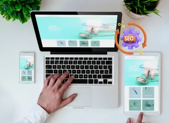 Dental clinic website design displayed across laptop, phone, and tablet