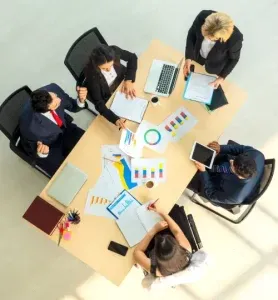 Overhead view of a business team in a strategy meeting
