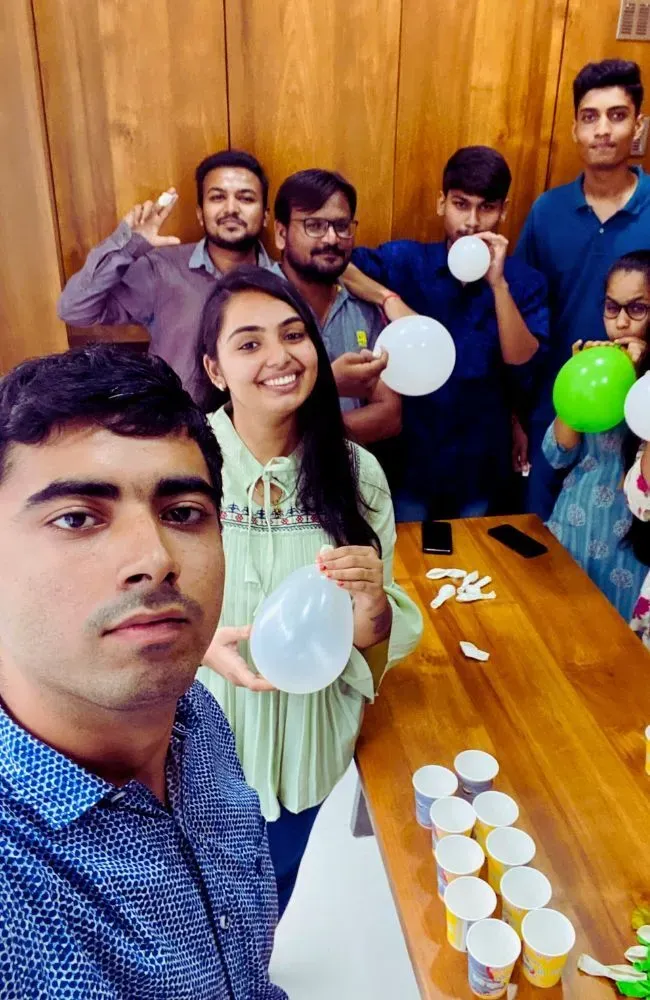 Adept Digitals team decorating for an office celebration