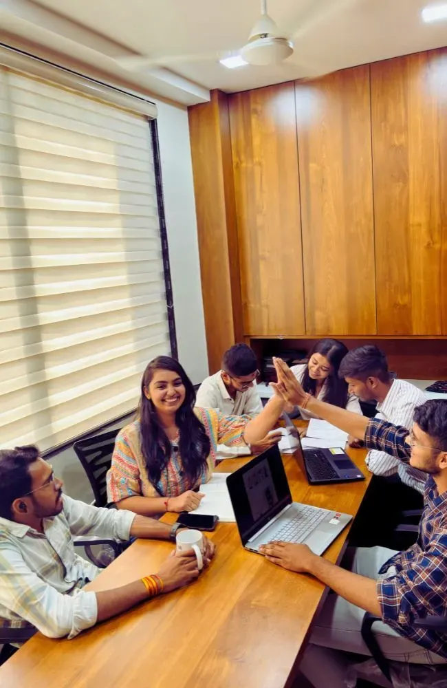 Adept Digitals team celebrating a win during a meeting
