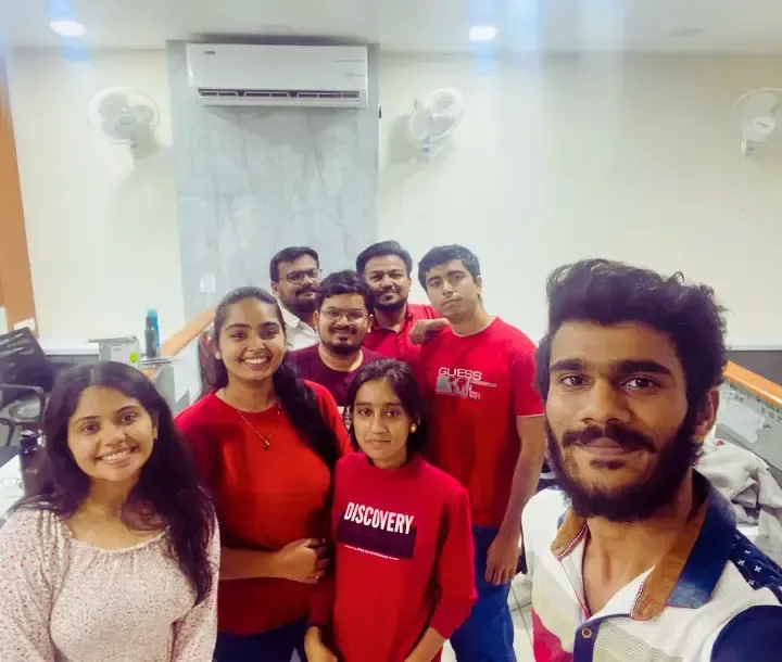 Adept Digitals team enjoying a casual red-theme day at the office