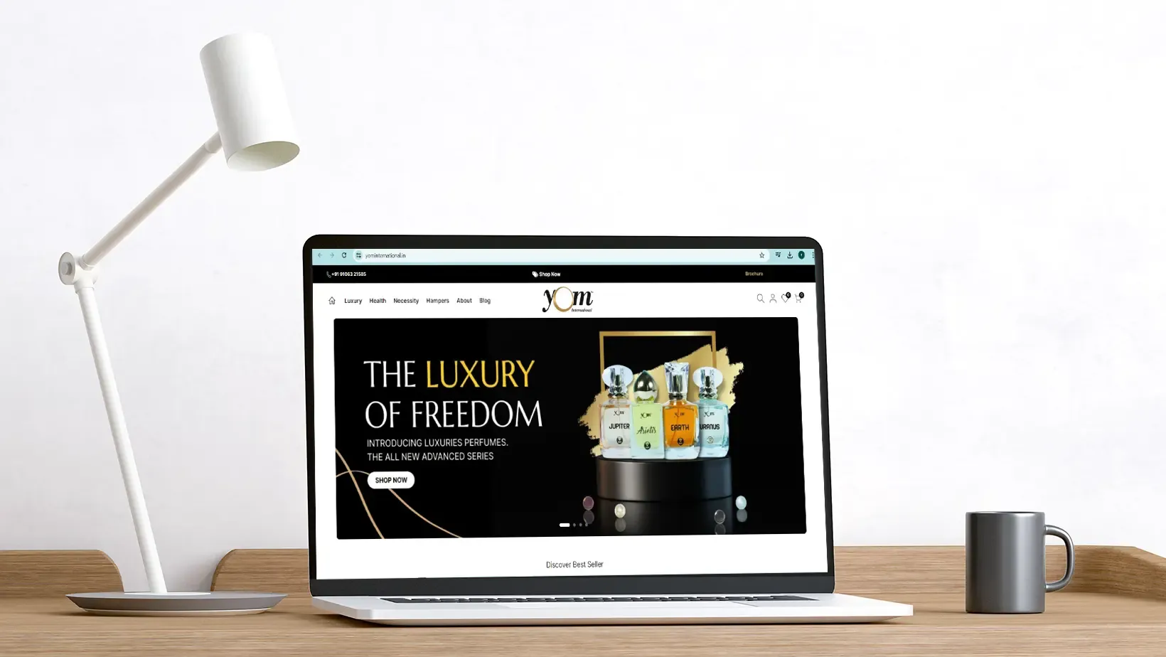 Laptop mockup of YOM International perfume e-commerce site by Adept Digitals